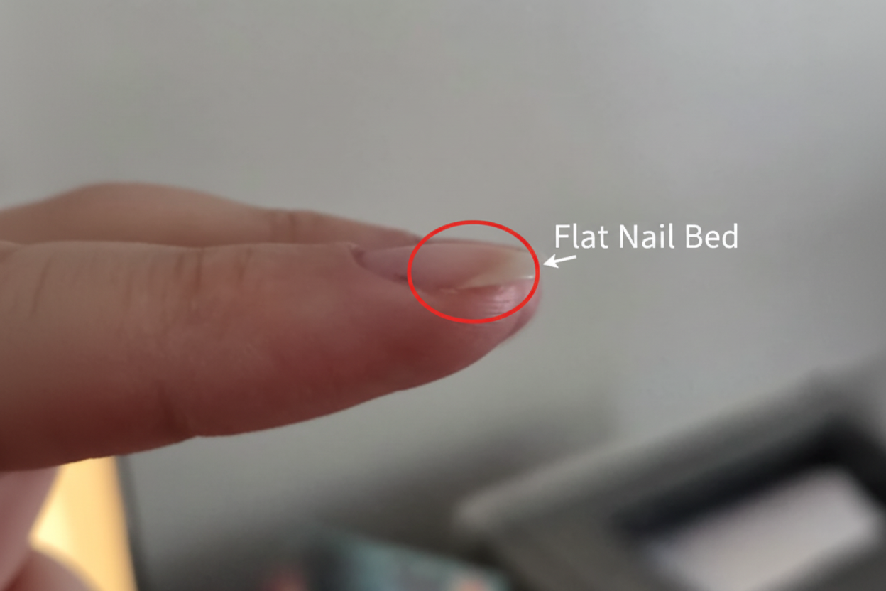 Flat nail bed close-up showing natural nail shape before press-on application