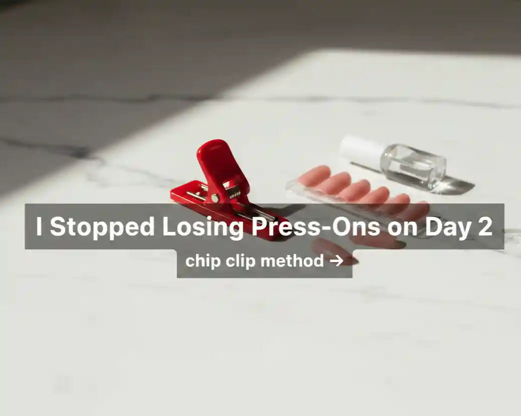 Red chip bag clip next to short almond blush press-on nails and nail glue on a white marble surface — MOONLEE Chip Clip Method for even pressure application