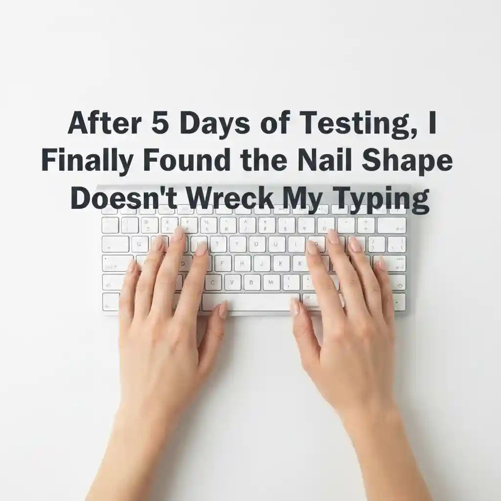 Two hands with short almond press-on nails typing on a white keyboard, overhead flat lay shot, with centered text reading: After 5 Days of Testing, I Finally Found the Nail Shape That Doesn't Wreck My Typing
