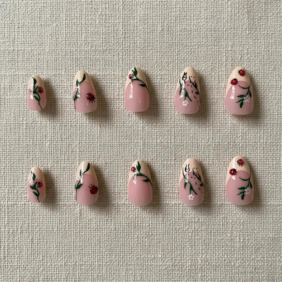 Cherry French Press-On Nails — flat lay product shot showing almond-shaped nails with cherry red tips, French manicure style | MOONLEE