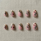 Cherry French Press-On Nails — flat lay product shot showing almond-shaped nails with cherry red tips, French manicure style | MOONLEE