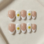 Daisy Dream Handmade Press-On Nails — hand-painted daisies on French tips on almond shape | MOONLEE
